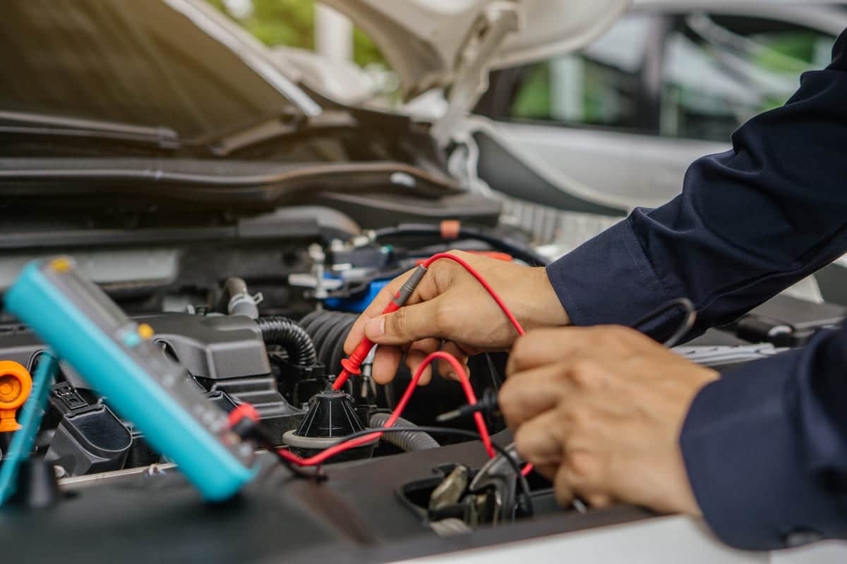 mechanic man working on the engine of the car in t 2023 11 27 05 28 41 utc(1)