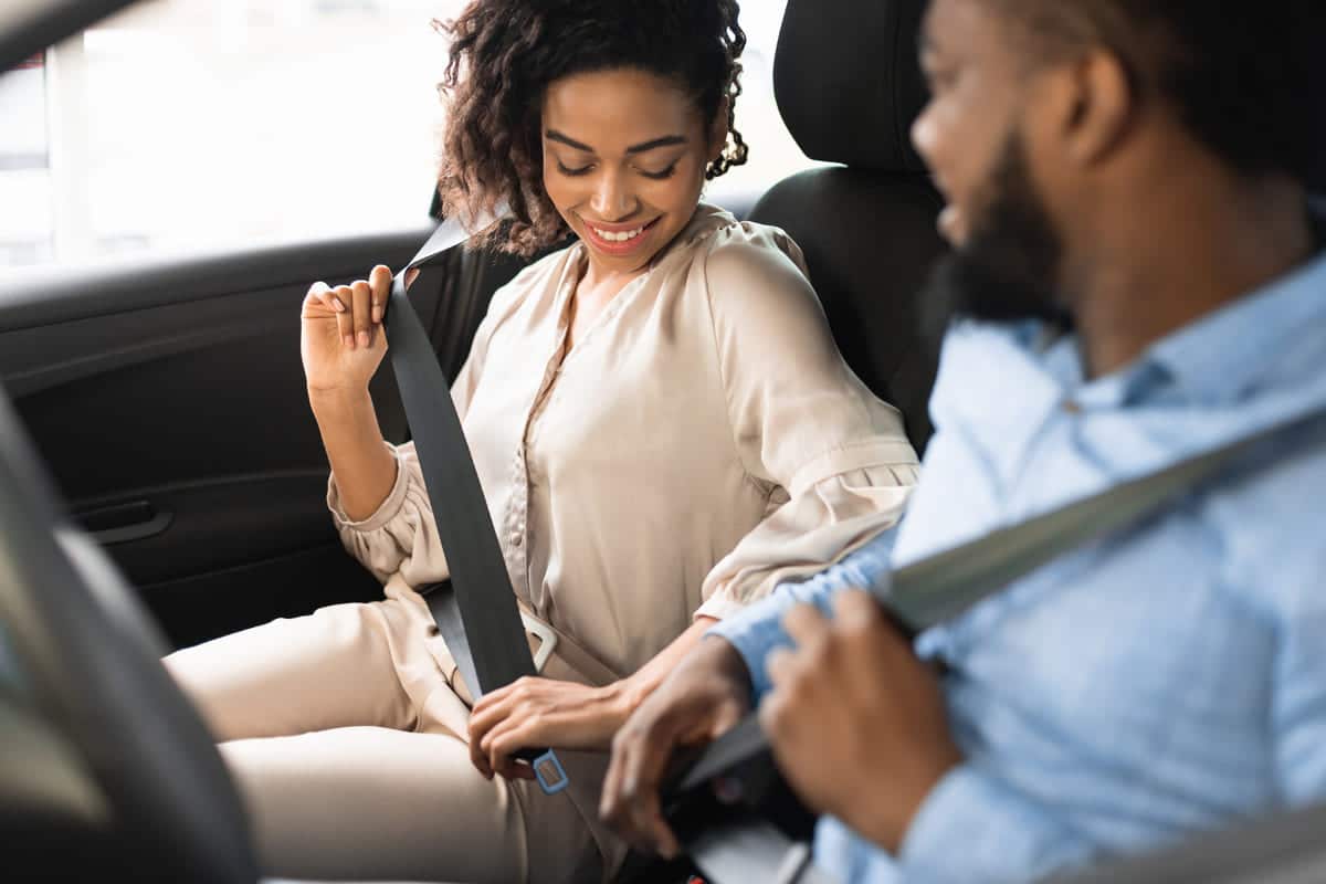 spouses sitting in car putting on seat belts in de 2023 11 27 05 27 21 utc(1)