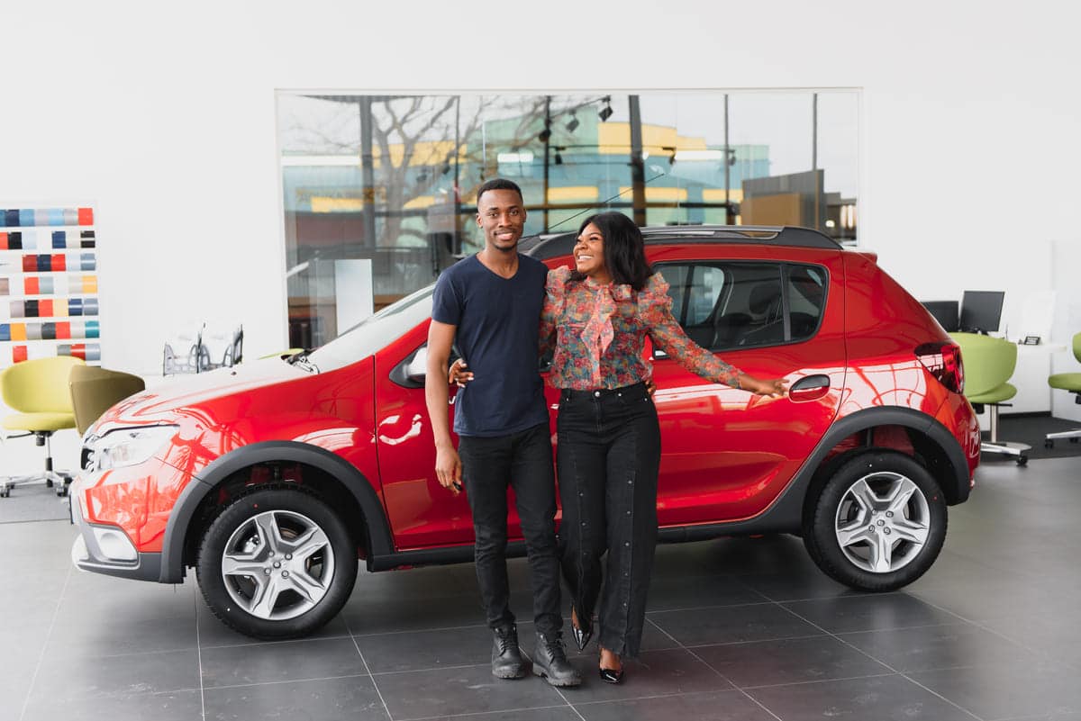 young african couple buying new car at dealership 2023 11 27 04 49 05 utc(1)