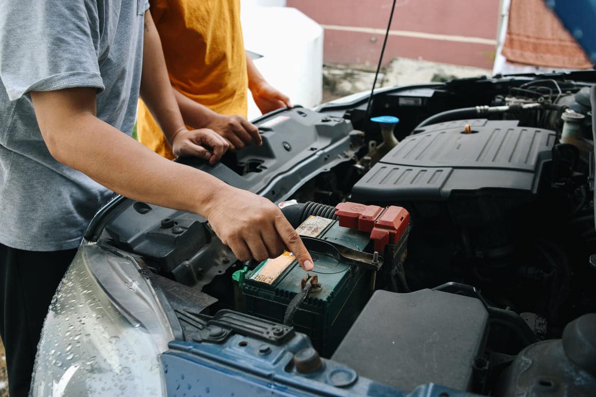 father teaching son how to repair and check car en 2024 04 30 14 12 20 utc(1)