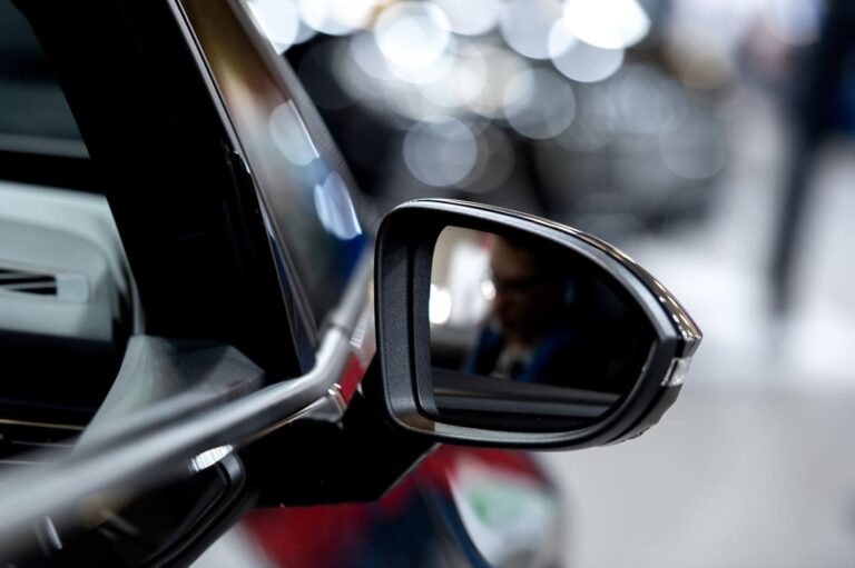 side rear view mirror on a modern car on blurred t 2023 11 27 04 51 47 utc(1)