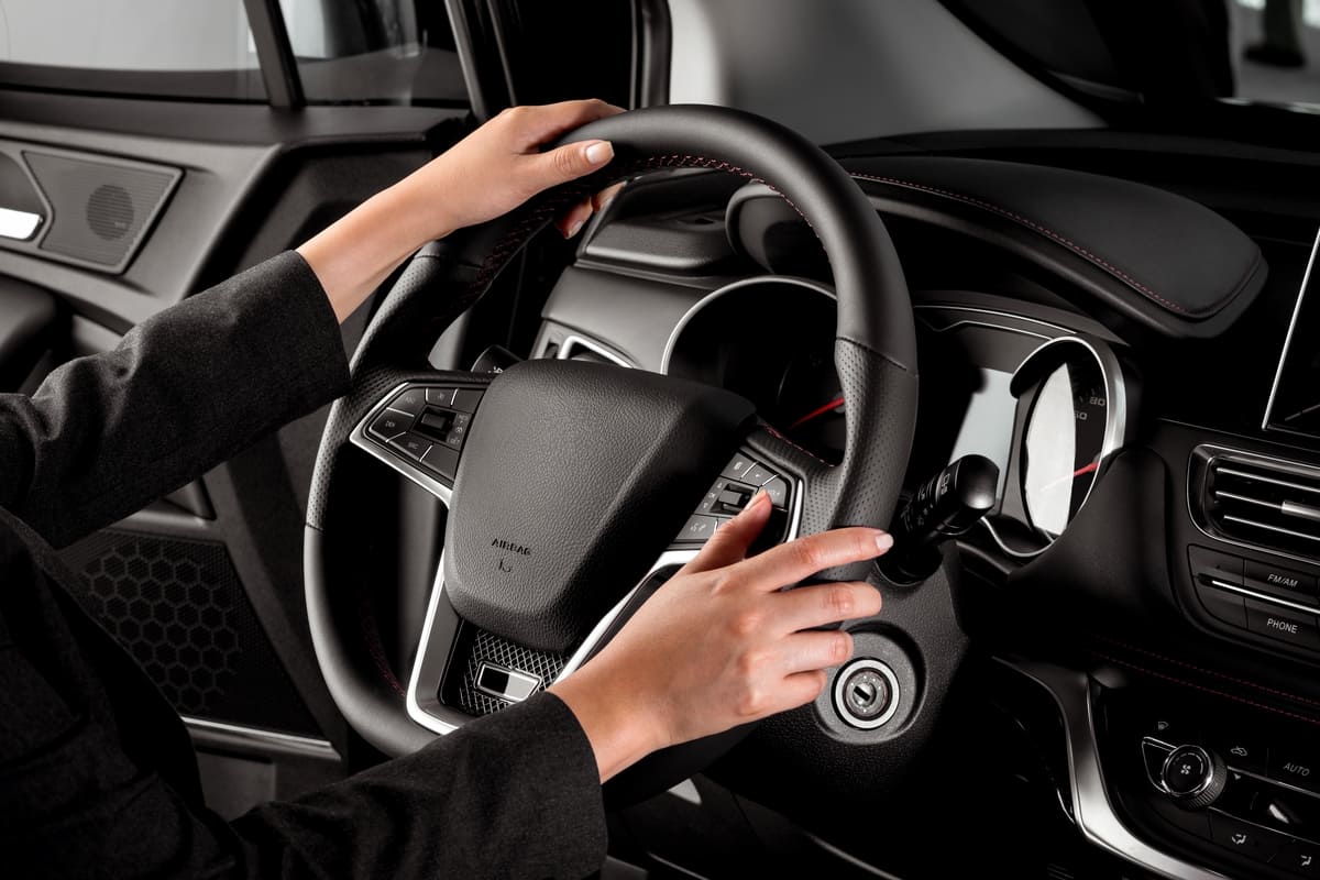 businesswoman s hands on the steering wheel of a l 2023 11 27 04 54 53 utc(1)