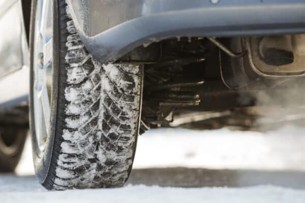 close up of car wheels rubber tire in deep snow t 2023 11 27 05 31 33 utc(1)