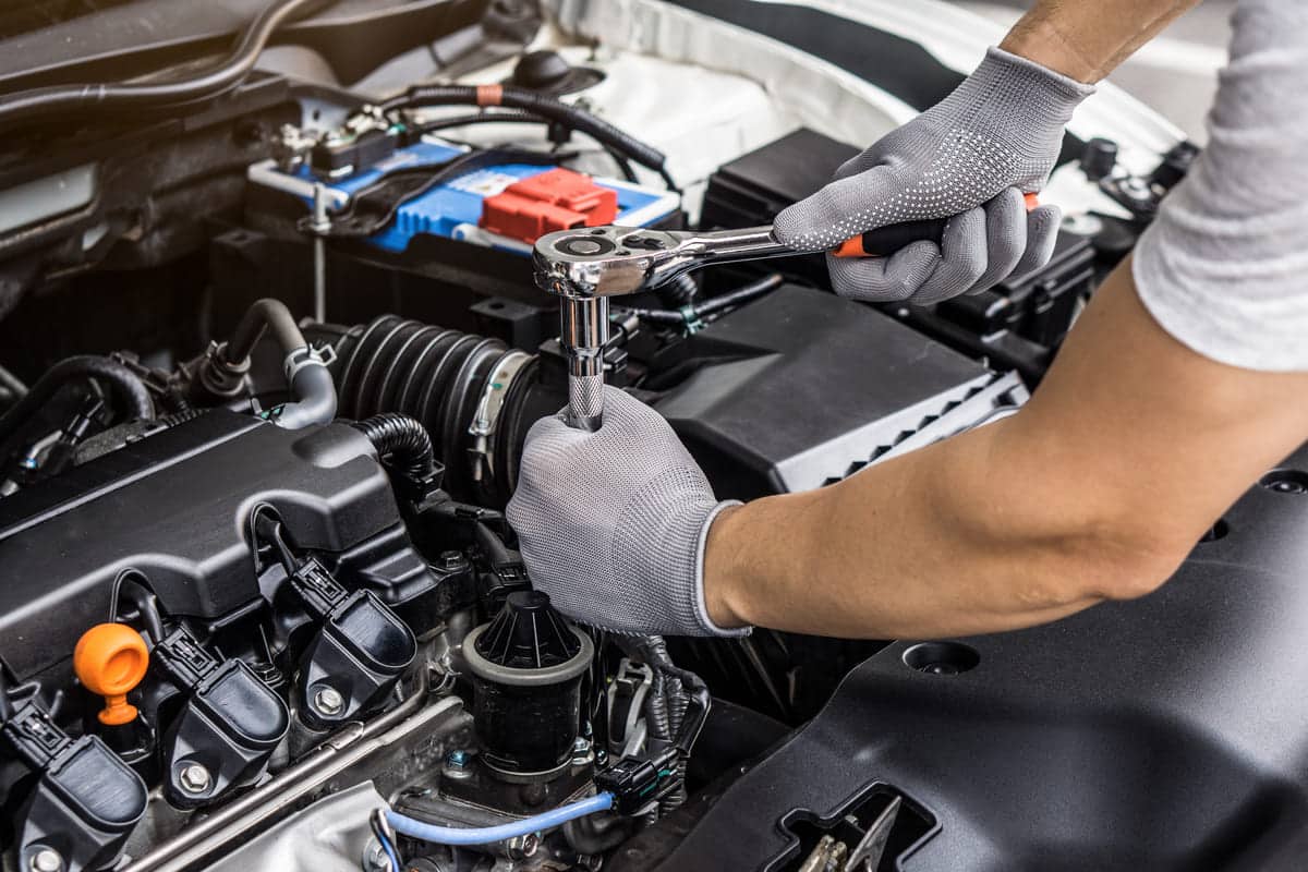 mechanic man working on the engine of the car in t 2023 11 27 05 00 48 utc(1)