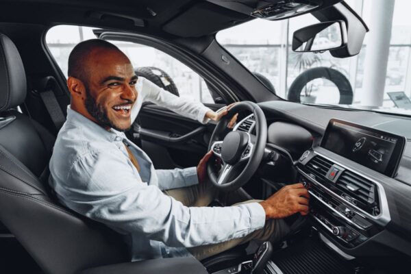 young african american man sitting in a new car in 2023 11 27 05 12 59 utc(1)